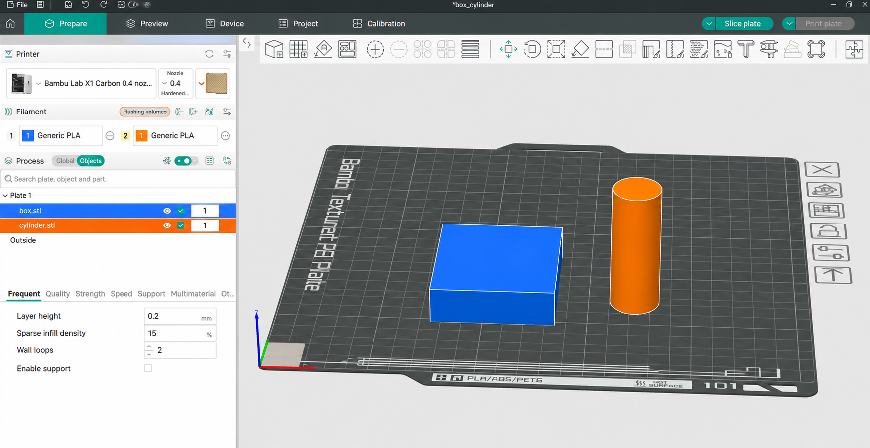 Blue box and orange cylinder STL files loaded as separate objects in the slicer